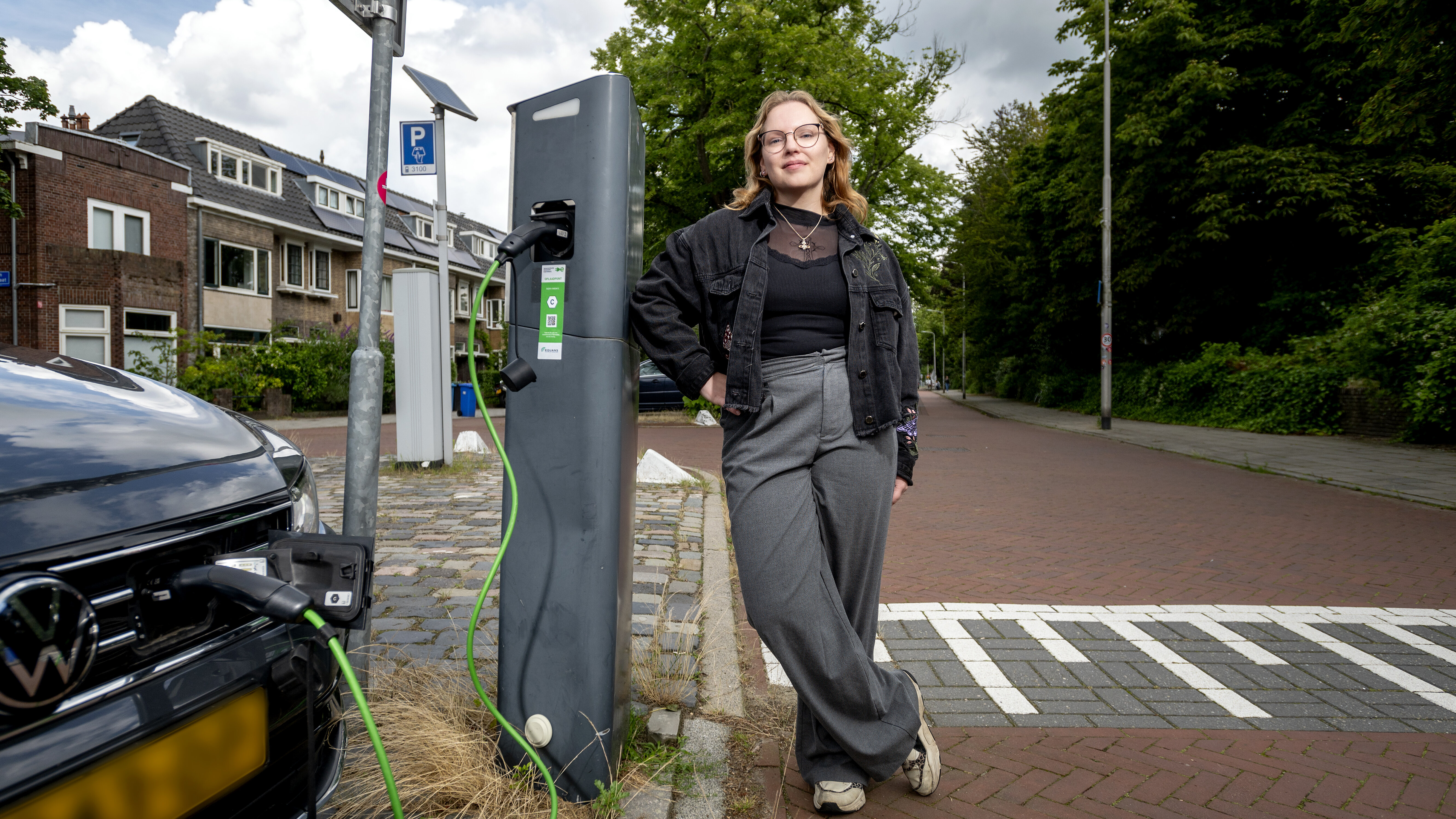 Researcher Mylene van der Koogh in front of a charging station